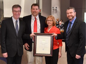 Mayor Jim Watson, along with Beacon Hill-Cyrville ward Coun. Tim Tierney,  presented the Mayor's City Builder Award to Kerry MacLean for his outstanding community service as a high school coach, and founder and president of the Maverick Volleyball Club. MacLean is seen accepting the award with his wife, Christine MacLean.