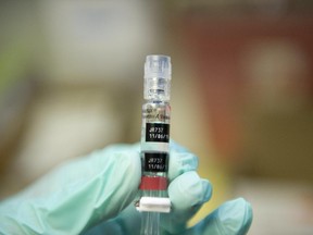 A nurse loads a syringe with a vaccine against hepatitis at a free immunization clinic for students before the start of the school year,  in Lynwood, California August, 27, 2013.  Nurses are immunizing children in preparation for the first day of public school on September 3. The clinic offers the mandatory vaccinations for school children against diphtheria, tetanus, pertussis, polio, hepatitis B,  MMR (measles, mumps, rubella) and chickenpox as well as some optional ones.