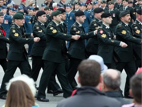 Veterans of the Afghanistan war march on Wellington Ave during the National Day of Honour on Parliament Hill.
