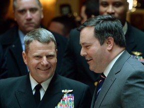 Defence Minister Jason Kenney, right, and Admiral William Gortney, NORAD and U.S. Northern Command, speak as they make their way to a bi-lateral meeting after speaking at the Conference of Defence Associations Institute conference on security and defence at the Chateau Laurier in Ottawa on Thursday, February 19, 2015.