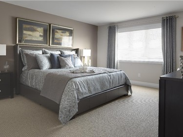 The appropriately plush master bedroom is done in soothing tones.