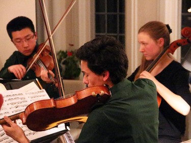Young musicians Jerry Wang, Emma Grant-Zypchen and Ethan Balakrishnan (not seen is Alisa Klebanov) from the Emerald String Quartet performed for guests of the Friends of the NAC Orchestra's Music to Dine For benefit held Wednesday, February 25, 2015 at the official residence of the Norwegian ambassador.