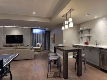 The Windermere's finished basement, an upgrade, includes a theatre space, wet bar, ping-pong table, and dance area.