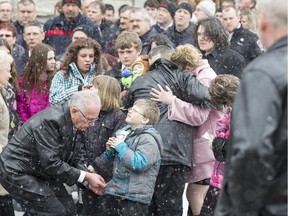 Parents Teenah Snowden and Eric Courtney, along with relatives, consoled each Friday after the funeral for Matthew Robillard, 4, and his sister Melanie Courtney, 2.