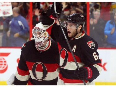 Andrew Hammond (L) and Bobby Ryan of the Ottawa Senators celebrate their victory against the Boston Bruins at Canadian Tire Centre in Ottawa, March 19, 2015.   (Jean Levac/ Ottawa Citizen)