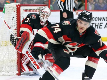 Andrew Hammond, left, and Mark Borowiecki of the Ottawa Senators during second period NHL action.