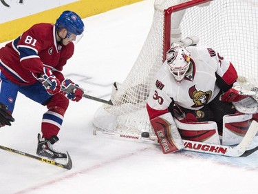 Ottawa Senators goalie Andrew Hammond makes a save on Montreal Canadiens' Lars Eller (81) during first period NHL hockey action.