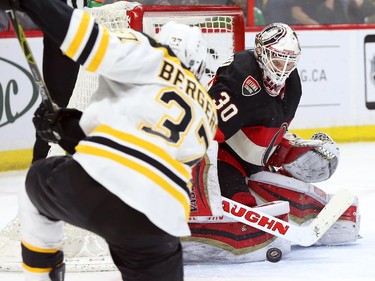 Andrew Hammond of the Ottawa Senators makes the save against Patrice Bergeron of the Boston Bruins during second period NHL action.