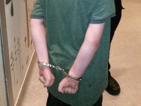 A photo of a boy with autism, then 11, after he was handcuffed last June. This photograph was taken by the boy's mother, with the permission of a police officer. She provided it to the Citizen.