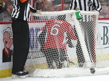 Bobby Ryan of the Ottawa Senators was pushed in the net against the Boston Bruins during first period NHL action.