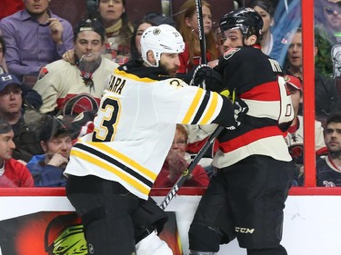 Bobby Ryan (R) of the Ottawa Senators is stopped by Zdeno Chara of the Boston Bruins during third period of NHL action at Canadian Tire Centre in Ottawa, March 19, 2015.   (Jean Levac/ Ottawa Citizen)
