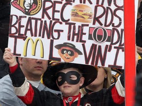 A young fan holds up a sign during an NHL game between the Ottawa Senators and the Boston Bruins at Canadian Tire Centre on March 19, 2015 in Ottawa, Ontario, Canada.