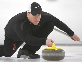 Bowie Abbis-Mills throws a rock at the Canadian mixed doubles curling team trials at the Ottawa Hunt and Golf Club on Sunday, March 15, 2015.