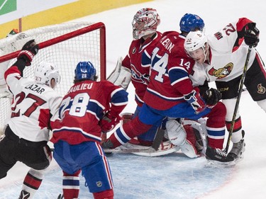 Ottawa Senators' Erik Condra, right, scores past Montreal Canadiens goalie Carey Price during second period NHL hockey action.