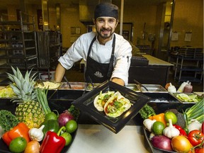 Chef Neil Dhawan, formerly of Earnscliffe, the official residence of the British High Commission, shows off one of his Thai blackened tilapia fish tacos at the Trainyards Farm Boy buffet bar Tuesday March 17, 2015.