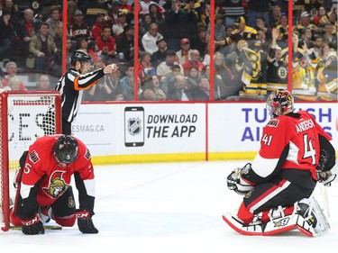 Cody Ceci, left, and Craig Anderson of the Ottawa Senators show their dejection after the second goal against his team by the Boston Bruins during second period NHL action.