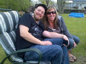 Cousins Christopher Taylor and Natasha Crosier pose together at her father's home on Wolfe Island in the summer of 2013 when Chris was in remission.