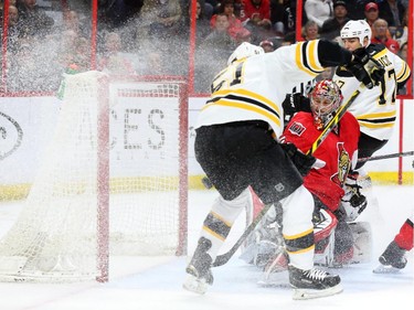 Craig Anderson of the Ottawa Senators can't save the goal by Ryan Spooner of the Boston Bruins during second period NHL action.