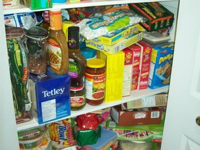 Credit: Karen Turner Crowded pantry for a Real Deal story on how to shop smartly when stocking the kitchen cupboards and fridge.