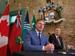 Daniel Alfredsson held a press conference before he received the key to the city from Deputy Mayor Bob Monette (R) outside the Mayor's office. Assignment - 119968 Photo taken at 18:59 on March 5. (Wayne Cuddington/Ottawa Citizen)