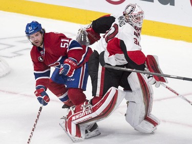 Montreal Canadiens' David Desharnais skates around Ottawa Senators goalie Andrew Hammond during second period NHL hockey action.