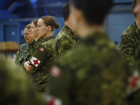 Soldiers wait for their medical assessments at the Ottawa International Airport on Friday, March 6, 2015, as troops return home from deployment in West Africa in support of global efforts to help prevent the spread of the Ebola virus.