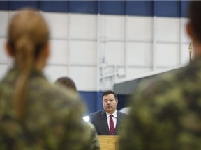 Minister of National Defence Jason Kenney, centre, addresses soldiers at the Ottawa International Airport on March 6, 2015.