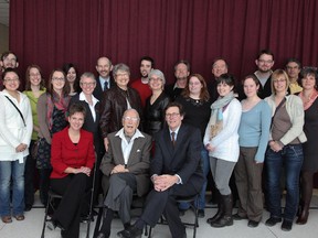 Ernest Côté is seen here (front and centre) in the fall of 2011 at the University of Ottawa to celebrate the bursary he spearheaded. He is sitting among a group including students in the U of O's new School of Information Studies.