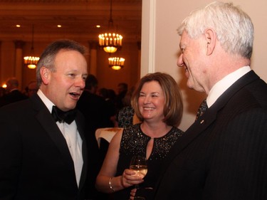 From left, Bank of Canada Governor Stephen Poloz and his wife, Valerie, in conversation with John Manley, CEO of the Canadian Council of Chief Executives, at the Politics and the Pen dinner held at the Fairmont Chateau Laurier on Wednesday, March 11, 2015.