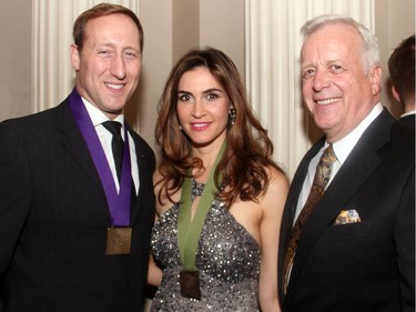 From left, Justice Minister Peter MacKay with his author wife, Nazanin Afshin-Jam, and former Tory cabinet minister Jay Hill at the Politics and the Pen dinner held at the Fairmont Chateau Laurier on Wednesday, March 11, 2015.