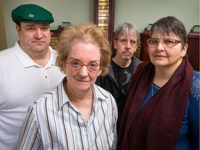 From left, Scott Helman, Gladys Whincup, Robert Dore and Lise Langevin are four of the fifty worker/clients of the Ottawa-Carleton Association for Persons with Developmental Disabilities who were told they would lose their jobs at a federal paper shredding facility at Tunney's Pasture. On Sunday, the government announced that it had reversed its decision.