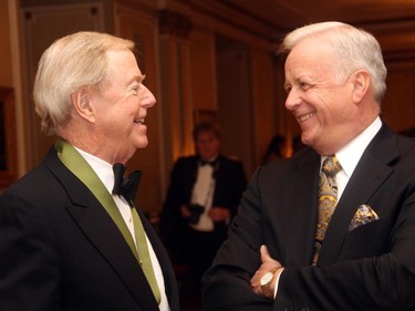 From left, veteran journalist and author Don Newman in conversation with former Tory cabinet minister Jay Hill at the Politics and the Pen dinner held at the Fairmont Chateau Laurier on Wednesday, March 11, 2015.