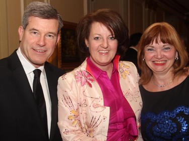 Grant McDonald with Rosemary Thompson from the National Arts Centre and his wife, Carol Devenny, at the Politics and the Pen dinner held at the Fairmont Chateau Laurier on Wednesday, March 11, 2015.