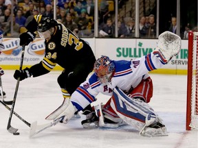 New York Rangers goalie Henrik Lundqvist makes a save on a shot attempt by Boston Bruins centre Carl Soderberg during the second period.