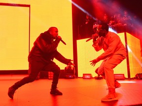 Kanye West, left, and Puff Daddy perform at HOT 97's "The Tip Off" at Madison Square Garden on Thursday, Feb 12, 2015, in New York. (Photo by Scott Roth/Invision/AP)