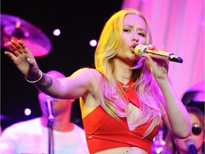 Singer Iggy Azalea performs at the Clive Davis Pre-Grammy Gala Press Day at the Beverly Hilton hotel in Beverly Hills, Calif.