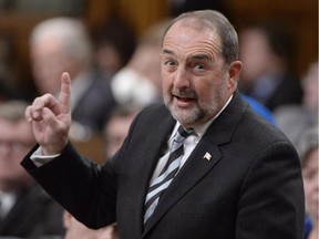 Infrastructure Minister Denis Lebel responds to a question during question period in the House of Commons on Parliament Hill in Ottawa on Tuesday, Feb. 3, 2015. Police in Quebec are investigating after envelopes containing white powder were sent to the riding offices of at least two federal ministers, including Lebel.