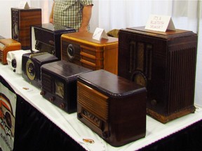 Jeff Jenkins shows off his antique bluetooth radios Saturday, March 21, 2015 at the Ottawa Antique and Vintage Market.
