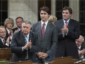 Liberal Leader Justin Trudeau rises in the House of Commons to vote against an air combat mission against ISIS on Tuesday, Oct. 7, 2014.