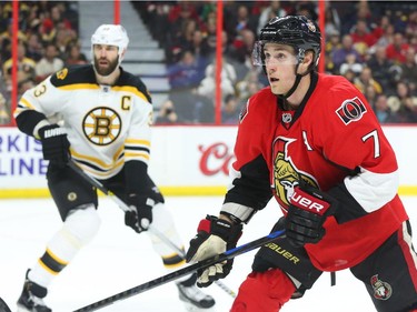 Kyle Turris of the Ottawa Senators in action against Zdeno Chara and the Boston Bruins during first period NHL action.