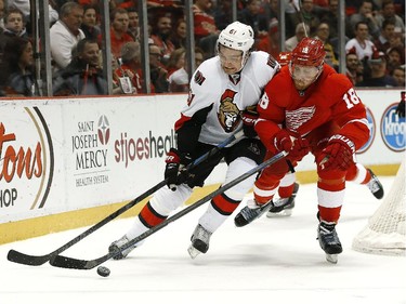Ottawa Senators right wing Mark Stone (61) and Detroit Red Wings center Joakim Andersson (18) battle for the puck in the second period.