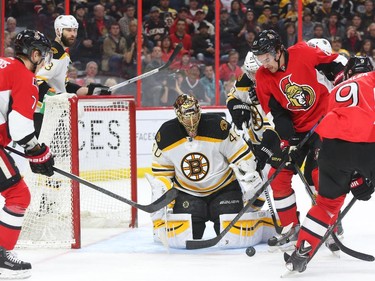 Mark Stone, right, of the Ottawa Senators tries to score against Tuukka Rask of the Boston Bruins during first period NHL action.