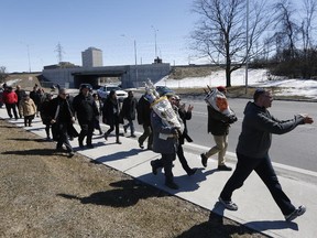 Members of the Congregation Beth Shalom of Ottawa marched from their 151 Chapel St. location to their temporary new home at the Soloway Jewish Community Centre near Broadview Avenue and Carling Road, a three-hour walk across the city, on Sunday, March 29, 2015. The congregants took turns holding the scroll and synagogue's mezuzah (a small encased scroll), which, as per Jewish tradition, will be affixed to the door of their new temporary home.