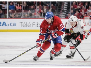 Montreal Canadiens right wing P.A. Parenteau, left, skates past Ottawa Senators left wing Matt Puempel, right, during the second period.