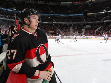 Curtis Lazar #27 of the Ottawa Senators takes a water break during warmups prior to the game.
