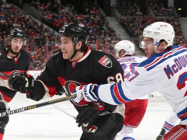 Mike Hoffman #68 of the Ottawa Senators battles for position against Ryan McDonagh #27 of the New York Rangers.