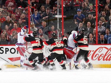 The New York Rangers celebrate a first period goal and third of the period against the Ottawa Senators.