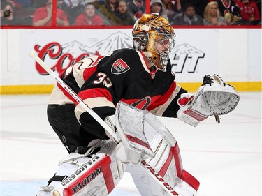 Chris Driedger #32 of the Ottawa Senators makes his NHL debut in a game against the New York Rangers in the first period.