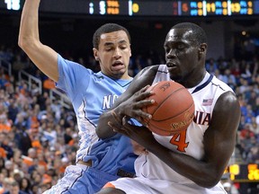Marial Shayok, right,  battles  Marcus Paige of the North Carolina Tar Heels during the semifinals of the 2015 ACC Basketball Tournament at Greensboro Coliseum.