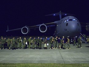 The first group of the Disaster Assistance Response Team (DART) returning to Canada boards a Royal Canadian Air Force CC-177 Globemaster III aircraft during Operation RENAISSANCE in Iloilo, Philippines on December 18, 2013.

Photo: MCpl Marc-Andre Gaudreault, Canadian Forces Combat Camera

Le premier groupe de l’Équipe d’intervention en cas de catastrophe qui rentre au Canada monte à bord d’un avion CC177 Globemaster III de l’Aviation royale canadienne, le 18 décembre 2013, à Iloilo (Philippines), dans le cadre de l’opération Renaissance.    

Photo : Cplc Marc-Andre Gaudreault, Caméra de combat des Forces canadiennes
IS2013-2006-237